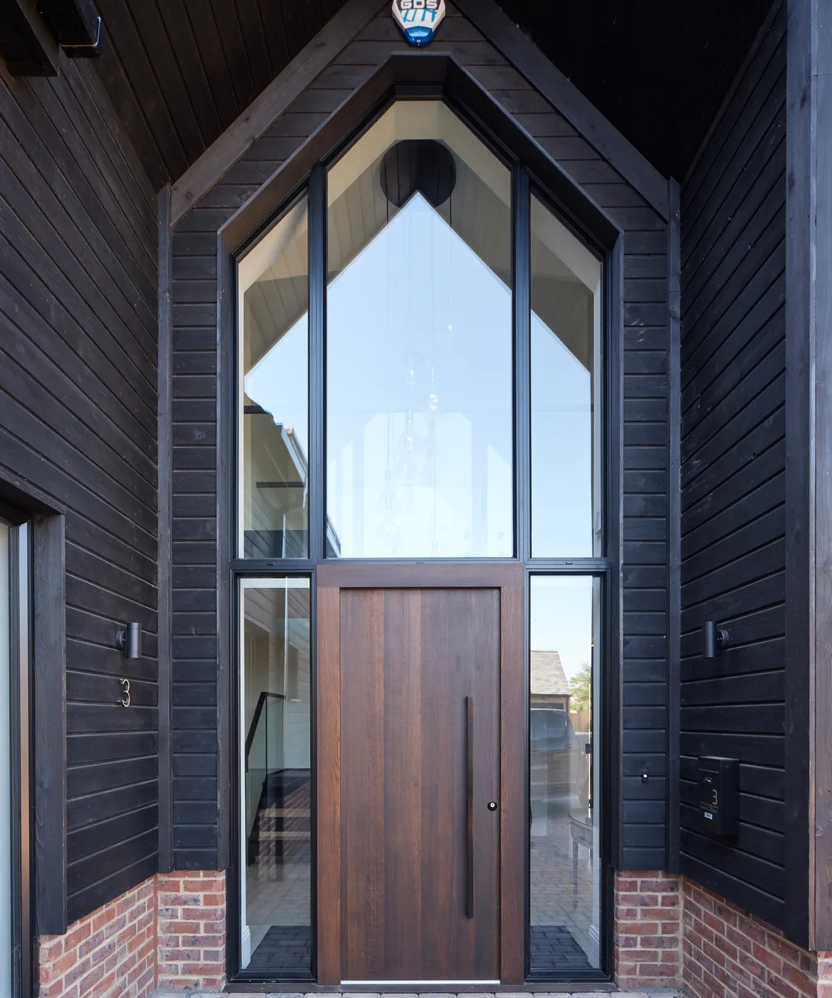 Striking Porch Design: A Perfect Blend of Bold Contrast and Natural Light