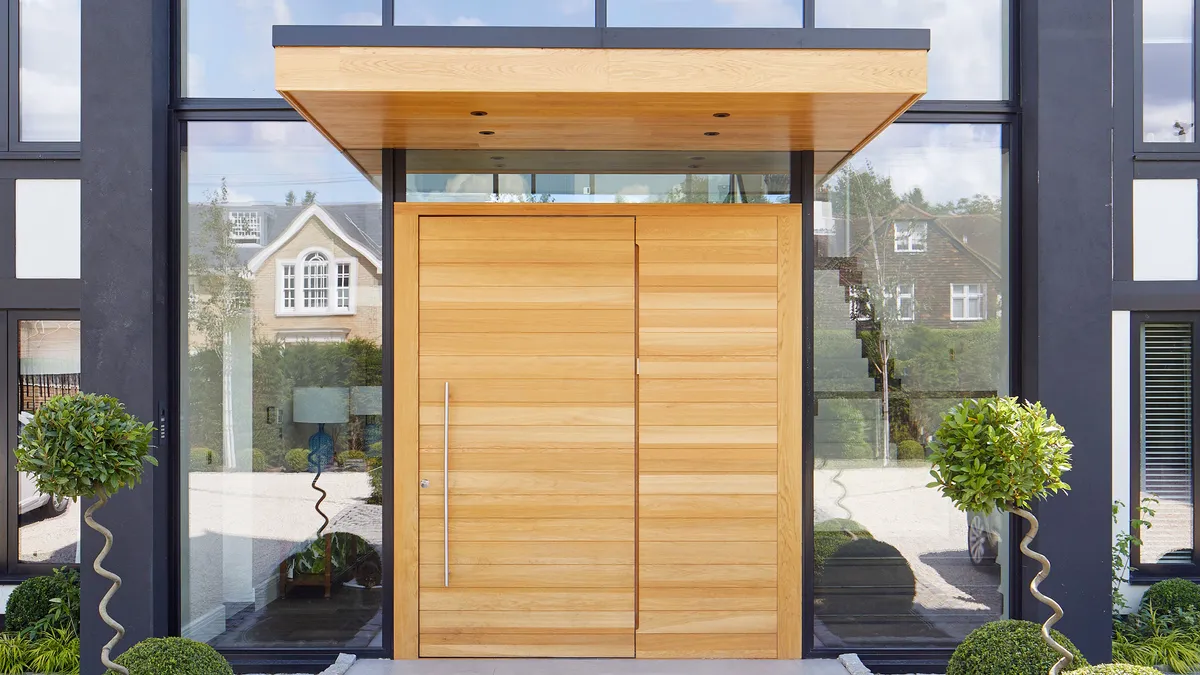 A simple projecting overhang over the front door looks stunning